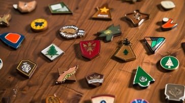 A set of clean enamel custom merchandise pins.